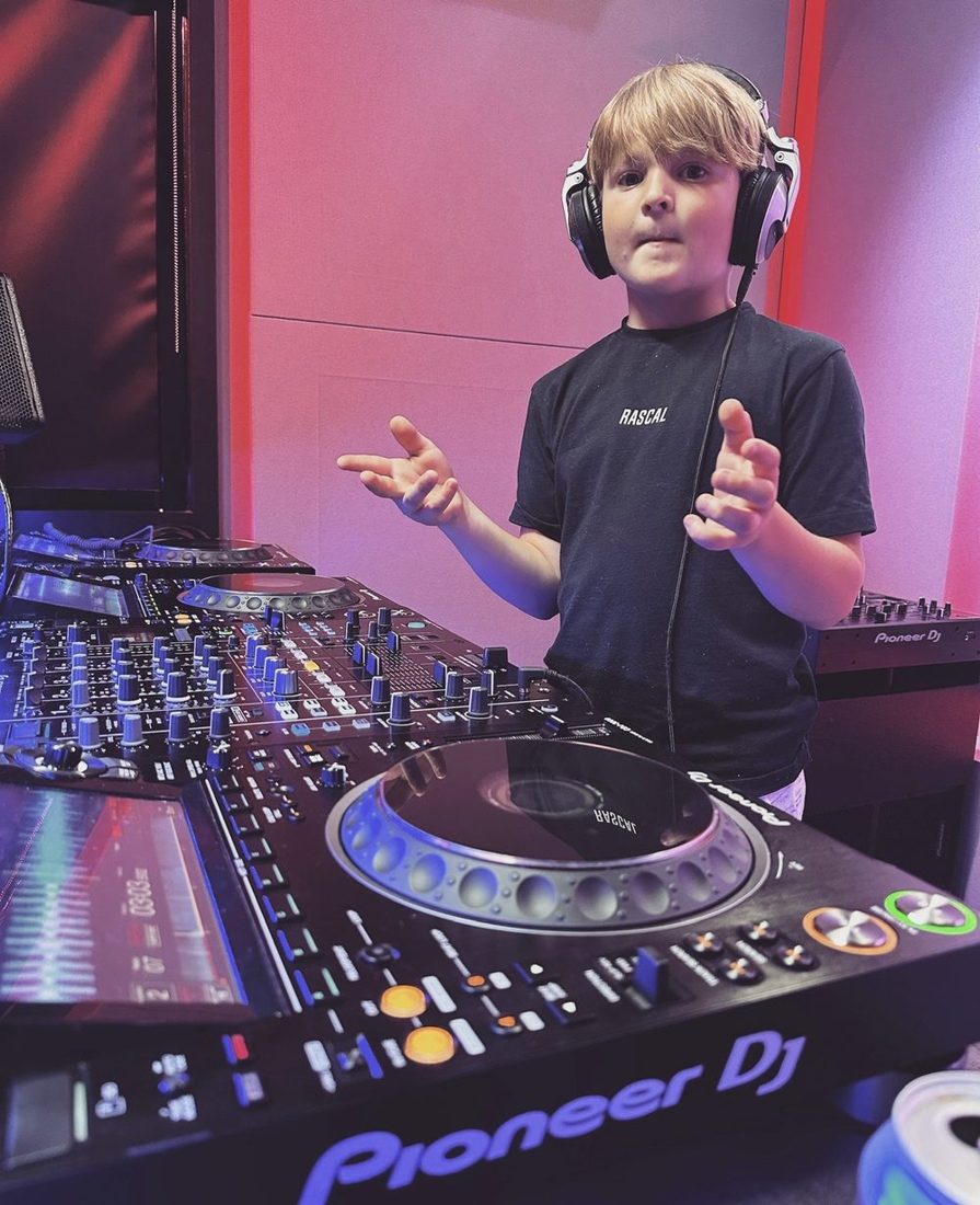 DJ Archie performing behind Pioneer decks